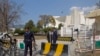 A police officer leaves the Supreme Court building in Islamabad January 31, 2013. Pakistan's powerful Supreme Court on Thursday ordered imminent general elections to go ahead as planned in a bid to quash fears a fledgling democratic process is about to be