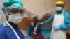FILE - A nurse and doctor stand by a patient in a Lassa fever ward at Kenema Government Hospital in southeastern Sierra Leone, Feb. 7, 2011.