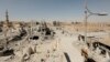 FILE - Damaged buildings are pictured during the fighting with Islamic State's fighters in the old city of Raqqa, Syria, Aug. 19, 2017. 