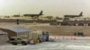 FILE - American military planes and support facilities are seen at the Al Udeid Air Base outside Doha, Qatar, in the Persian Gulf in this undated photo.