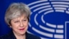 British Prime Minister Theresa May is welcomed by European Parliament President Antonio Tajani before their meeting at the European Parliament in Brussels, Feb. 7, 2019. 