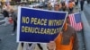 FILE - Protesters march toward the U.S. Embassy during a rally supporting the U.S. policy to put steady pressure on North Korea, in Seoul, South Korea, Nov. 3, 2018. 