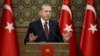 Tayyip Erdogan addresses a gathering of local leaders in Ankara, Turkey, Dec. 1, 2016.
