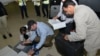 Samples brought back by the U.N. chemical weapons inspection team are checked in upon their arrival at The Hague, Netherlands, August 31, 2013.