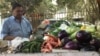 Vegetable vendor Shiv Shankar is angry that he cannot use now-outdated currency to buy goods from wholesale markets. (A. Pasricha/VOA) 