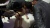 FILE - A child is treated in a hospital in Douma, eastern Ghouta, near Damascus, Syria, after a suspected chemical weapons attack April, 7, 2018. (White Helmets handout via Reuters) 