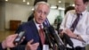 FILE - Senate Foreign Relations Committee Chairman Bob Corker, R-Tenn., shown talking to reporters after a briefing on talks with Iran in February, expects only a few votes on amendments to his Iran legislation.