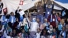 Supporters of the Ennahda movement holds flags during the movement's congress in Tunis,Tunisia, May 20, 2016. 