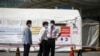 Hospital workers stand in front of a quarantine area set up at a hospital in Seoul, South Korea, June 2, 2015.