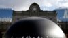 FILE - The words "Knock out the toxic tonnes" are seen on a giant ball during a protest by environmental activists in front of the European Parliament in Brussels , Belgium.