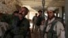 Fighters of the Syria Democratic Forces (SDF) stand inside a building near Manbij, in Aleppo Governorate, Syria on June 17, 2016. 