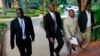 M23 rebel negotiators are seen heading into the final leg of negotiations with the Congolese government, in Kampala October 19, 2013. 