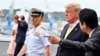 U.S. President Donald Trump, with Japan's Prime Minister Shinzo Abe, is seen as he leaves the Japanese destroyer JS Kaga, after a tour in Yokosuka, south of Tokyo, Japan, May 28, 2019.