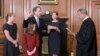 Chief Justice John Roberts administers the constitutional oath to Brett Kavanaugh at the Supreme Court building in Washington, Oct. 6, 2018, with the new justice's wife, Ashley, holding the Bible and their daughers looking on. (F. Schilling/Collection of 