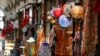 A shop worker waits for customers in a market in Istanbul, Sept. 13, 2018. 