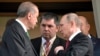 Turkish President Recep Tayyip Erdogan, left, speaks to Russian President Vladimir Putin, right, as he leaves after their meeting in Putin's residence in the Russian Black Sea resort of Sochi, Russia, Wednesday, May 3, 2017.