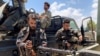 Troops loyal to Libya's internationally recognized government prepare themselves before heading to Sirte, in Tripoli, Libya, July 6, 2020.