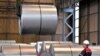 FILE - A worker moves steel coils at the Thyssenkrupp steel factory in Duisburg, Germany, April 27, 2018. German reaction to the announcement of U.S. tariffs being placed on steel and aluminum imports was among the fiercest in Europe.