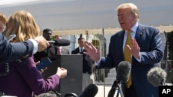 President Donald Trump speaks to reporters on the South Lawn of the White House in Washington, June 22, 2019, before boarding Marine One for the trip to Camp David in Maryland. 
