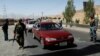 Afghan security forces keep watch at a checkpoint on the Ghazni highway, in Maidan Shar, the capital of Wardak province, Afghanistan, Aug. 12, 2018.