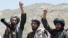 FILE - Taliban fighters listen to a speech by a senior leader in Shindand district of Herat province, Afghanistan, May 27 2016. 
