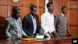 Left to right, Hussein Hassan Mustafah, Adan Dheq, Liban Abdullah Omar, and Mohamed Ahmed Abdi, who are charged with aiding the gunmen involved in the Westgate Mall attack in Sept. 2013, appear during their ongoing trial at Milimani court in Nairobi, Kenya, Dec. 20, 2018.