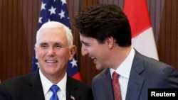 El Primer Ministro de Canadá, Justin Trudeau, da la bienvenida al vicepresidente estadounidense, Mike Pence, al parlamento canadiense.
30 de mayo, 2019.