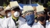 Protesters wear masks as a precaution against the MERS, Middle East Respiratory Syndrome, virus during a rally against government's labor policy in Seoul, South Korea, Sunday, June 7, 2015.
