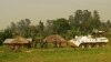 A Bangladeshi patrol from the United Nations Organization Stabilization Mission in the Democratic Republic of the Congo (MONUSCO) passes by Congolese soldiers in Gety, near Kaswara, Ituri province, on Jan. 26, 2016. Renewed fighting in the province has killed dozens of people and created a wave of refugees.