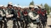 FILE - Kurdish Peshmerga fighters take part during a training session by coalition forces in a training camp in Irbil, north of Iraq, March 9, 2016.