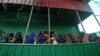 FILE - Newly displaced Somali women queue with their malnourished children as they try to receive medical treatment on outskirts of Mogadishu on April 11, 2017. 