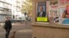 A billboard in Paris for former prime minister Alain Juppe, the front runner in the conservative primaries, Paris, Nov. 18, 2016. (L. Bryant/VOA)
