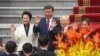 China's President Xi Jinping, second from left, his wife, Peng Liyuan, left, Vietnam's Communist Party General Secretary Nguyen Phu Trong, second from right, and his wife attend a welcome ceremony at the Presidential Palace in Hanoi on Dec. 12, 2023.