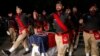Pakistani police officers attend the funeral of their colleague Tahir Dawar in Peshawar, Pakistan, Nov. 15, 2018. 