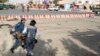 Afghan security personnel carry an injured man after an attack near the Kabul Airport, in Kabul, Afghanistan, July 22, 2018.