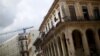 FILE - A crane is seen behind an old building in Havana, Cuba, Sept. 18, 2015. As new construction is booming in Cuba, European businesses may view a tougher U.S. policy toward Havana as “an opportunity for them to step in,” a Cuba expert says.