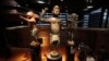 FILE - Three large royal statues of the Kingdom of Dahomey are displayed at the Quai Branly Museum in Paris, France, Nov. 23, 2018. 