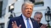 President Donald Trump speaks with reporters as he walks to Marine One on the South Lawn of the White House, July 29, 2020, in Washington.