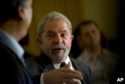 Brazil's former President Luiz Inacio Lula da Silva speaks during a press conference, after a meeting with Rio de Janeiro's Governor Luiz Pezao, in Rio de Janeiro, Dec. 3, 2015.