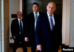 FILE - White House Chief of Staff John Kelly (R) and President Donald Trump's attorney Emmet Flood (L) arrive for a classified briefing for the U.S. congressional leadership from FBI and intelligence officials on the FBI probe into Russia's meddling in the 2016 election held in the U.S. Capitol building on Capitol Hill in Washington, U.S., May 24, 2018.