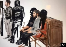 In this courtroom sketch, Salah Abdeslam, right, and Soufiane Ayari, left, appear at the Brussels Justice Palace in Brussels on Monday, Feb. 5, 2018.
