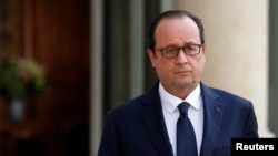 French President Francois Hollande holds a news conference after Air Algerie flight AH5017 crashed on Thursday en route from Ouagadougou in Burkina Faso to Algiers at the Elysee Palace in Paris, July 24, 2014.