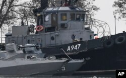 FILE - Damage on one of three Ukrainian ships is seen after it had been seized, Nov. 25, 2018, in Kerch, Crimea.