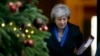 Britain's Prime Minister Theresa May leaves 10 Downing Street for Prime Minister's Questions at the House of Commons, in London, Dec. 19, 2018. 