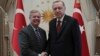 Turkey's President Recep Tayyip Erdogan, right, and U.S. Republican Senator Lindsey Graham shake hands before a meeting in Ankara, Turkey, Jan. 18, 2019. 