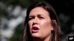 White House press secretary Sarah Sanders talks with reporters outside the White House in Washington, June 11, 2019. President Donald Trump announced on June 13 that Sanders would leave her job as press secretary at the end of June.
