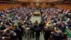 FILE - Britain's Prime Minister Theresa May addresses the House of Commons on her government's reaction to the poisoning of former Russian intelligence officer Sergei Skripal and his daughter Yulia in Salisbury, in London, March 14, 2018. 