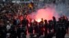 Riot policemen stand guard as the right-wing supporters protest after a German man was stabbed last weekend in Chemnitz, Germany, Aug. 27, 2018.