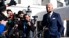 FILE - President Joe Biden talks to reporters before boarding Marine One on the South Lawn of the White House, Jan. 11, 2022, in Washington.