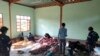 Warga membersihkan jenazah para korban serangan udara di sebuah bangunan di Desa Kanan, Kota Khampat, wilayah Sagaing, Myanmar, Minggu, 7 Januari 2024. (Foto: Associated Press)